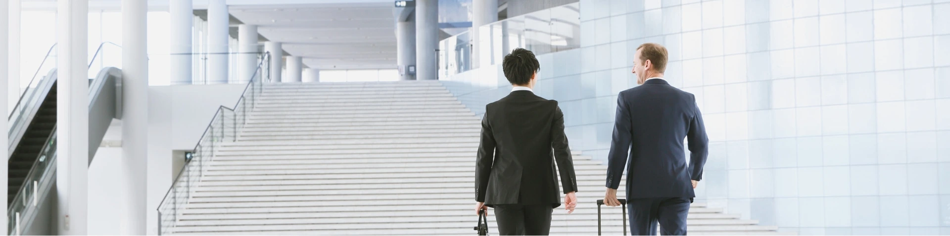 Two hands connecting puzzle pieces to symbolize partnership